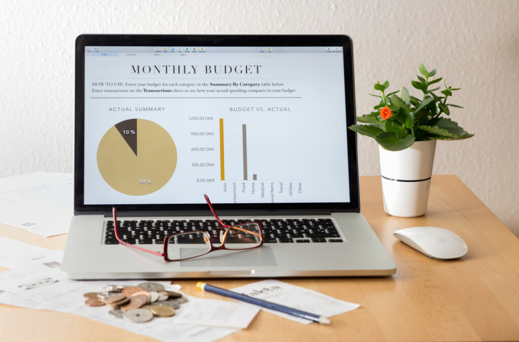 A Laptop Screen Displaying A Persons Monthly Budget, For Article 10 Smart Downsizing Tips For Empty Nesters 
